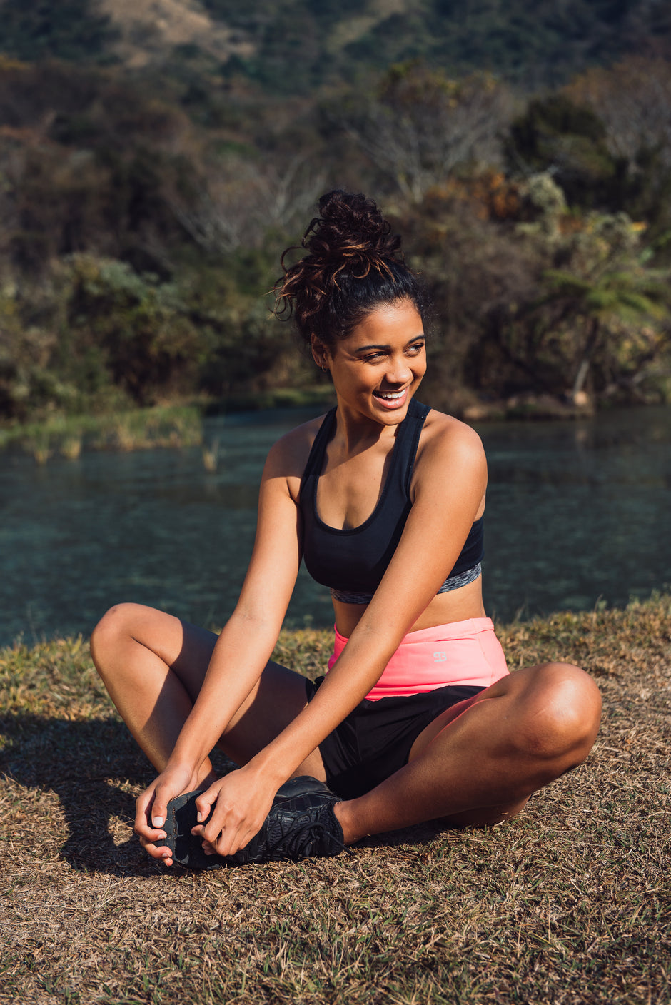 Lady stretching whilst wearing a StashBandz fitness belt