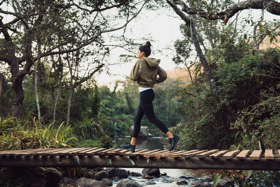 Lady running whilst wearing a StashBandz fitness belt