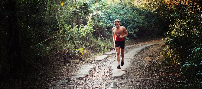 Man running with a StashBandz running belt